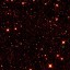 广角红外巡天探测器在4.6微米波段上拍摄到的2010 TK7（绿圈所示）。图像所有：NASA/JPL-Caltech/UCLA